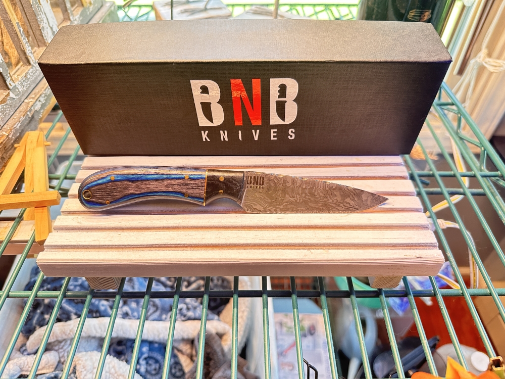 Beautiful Buck and Bear knife with blue burl maple handle for purchase! White Walker!