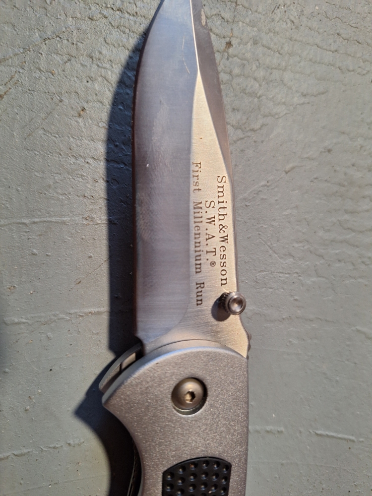 Smith & Wesson S.W.A.T First Millennium Run overall length 7 1/2\" blade 3 1/2\" handle 4\"