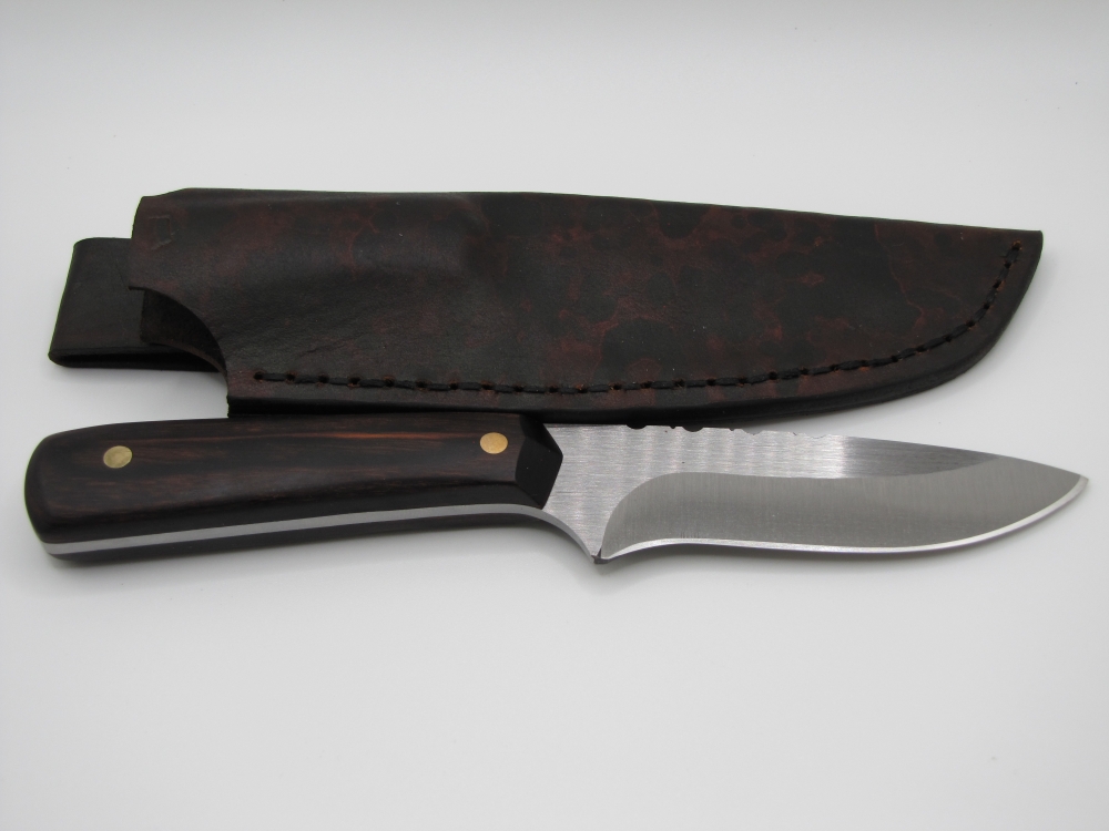drop point utility knife 1095 high carbon steel with a walnut dymalux handle