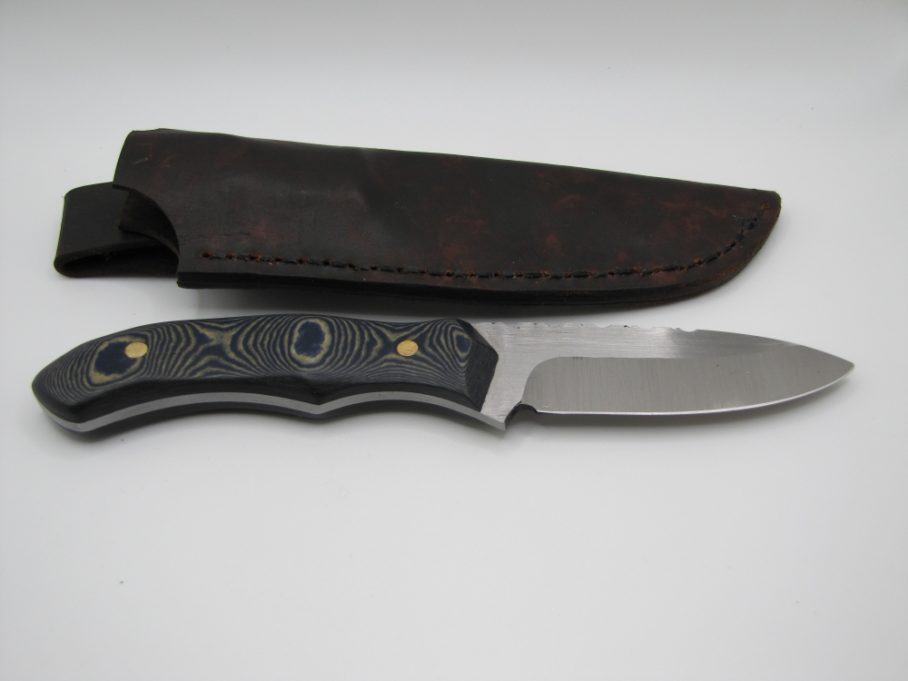 1095 high carbon steel drop point utility blade with a blue and white paper micarda handle
