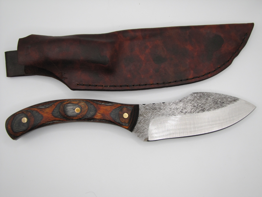 1095 high carbon steel camp knife with a walnut and black dymalux handle