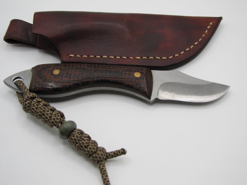 1095 high carbon steel clip point utility knife with a burlap micarta handle