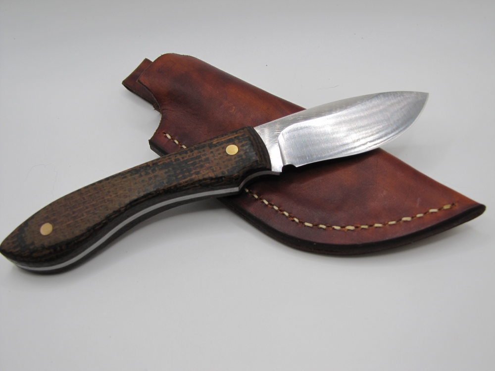 1095 high carbon steel drop point skinner with a burlap micarda handle