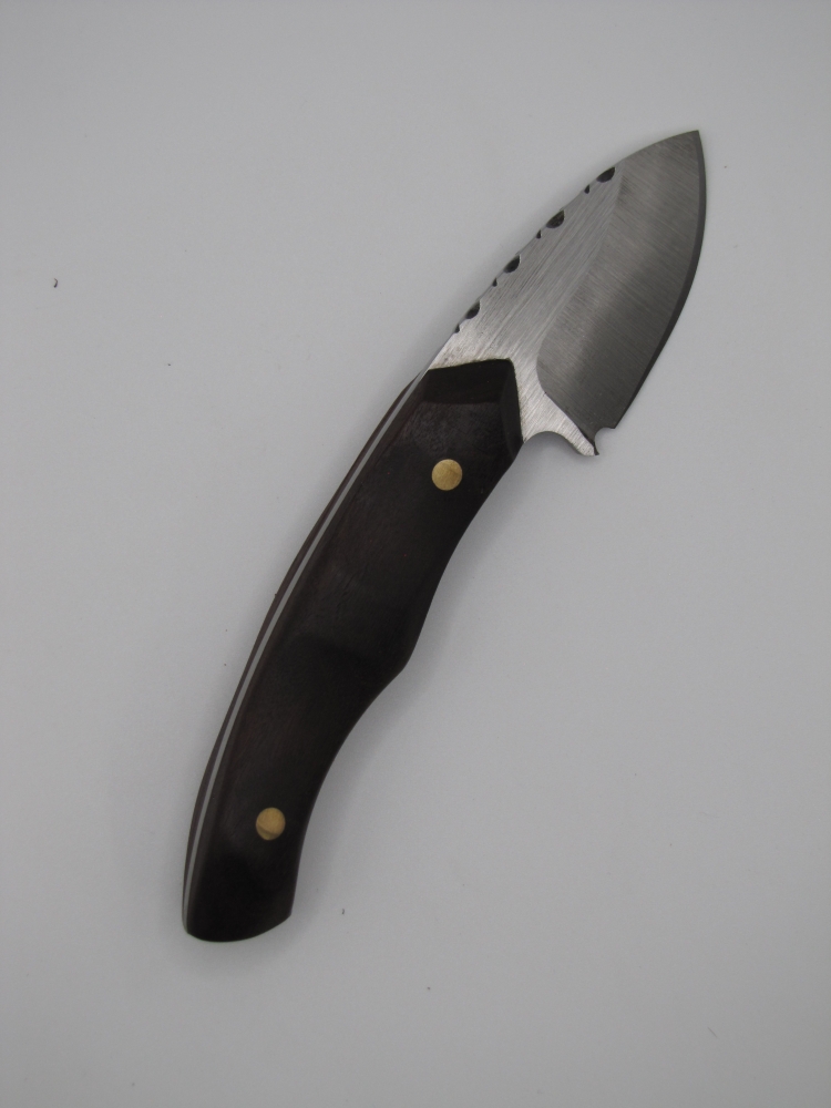 1095 high carbon steel caping knife with a drop point with natural wood handles