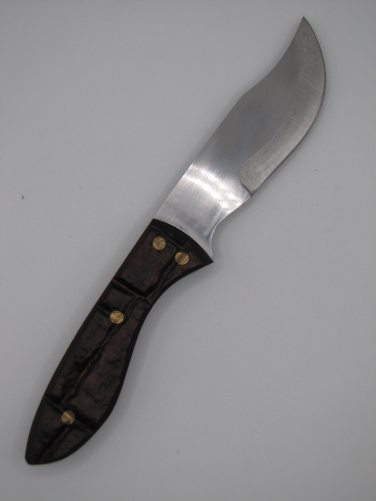 1095 high carbon steel clip point skinning knife with a brick like walnut dymalux handle