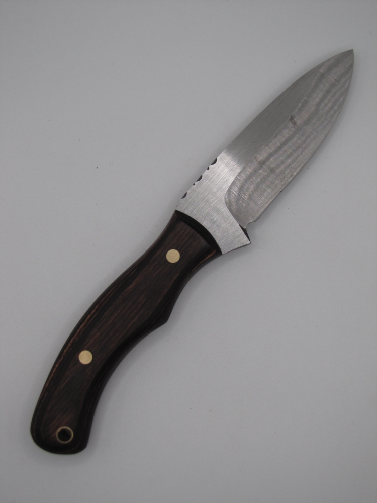 1095 highcarbon steel drop point utility knife with a walnut dymalux handle