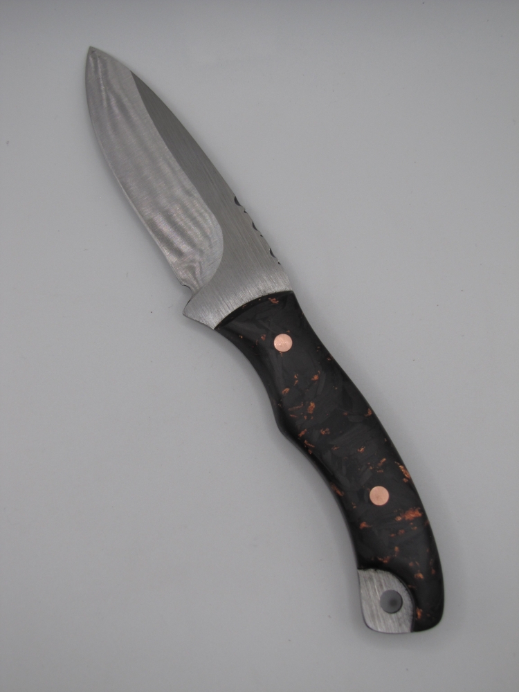 1095 high carbon steel drop point utility knife with a carbon fiber and copper handle