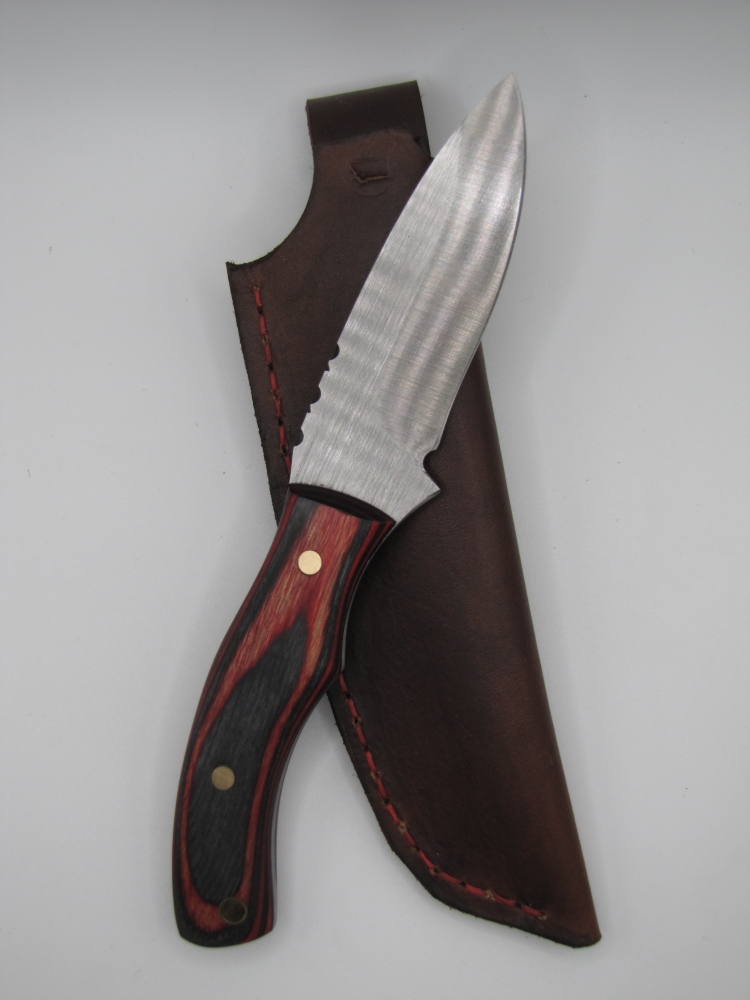 drop point utility knife 1095 high carbon steel with a red an black dymalux handle