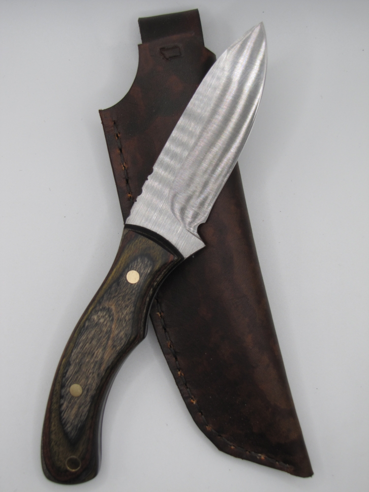 1095 highcarbon drop point utility knife with a black olive walnut camo dymalux handle