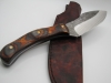 1095 high carbon steel camp knife with a walnut and black dymalux handle