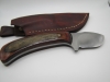 1095 high carbon steel drop point big belly skinner with a red walnut black dymalux handle