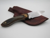 1095 high carbon steel drop point skinner with a black walnut an natural camo dymalux handle