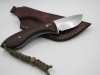 1095 high carbon drop point skinning knife with a red micarta handle with lanyard