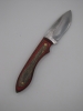 1095 high carbon steel drop point skinner with red and black dymalux handle