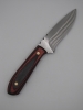 drop point utility knife 1095 high carbon steel with a red and back dymalux handle