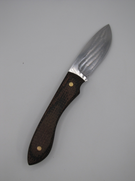 1095 high carbon steel drop point skinner with a burlap micarda handle