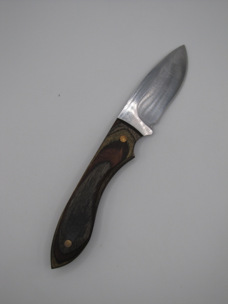 1095 high carbon steel drop point skinner with black olive walnut camo dymalux handle