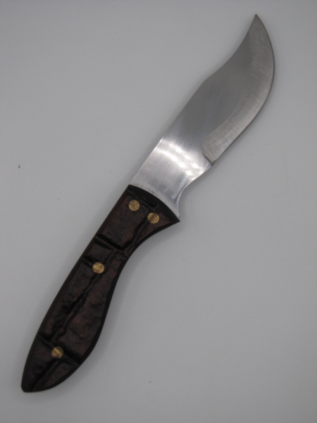 1095 high carbon steel clip point skinning knife with a brick like walnut dymalux handle
