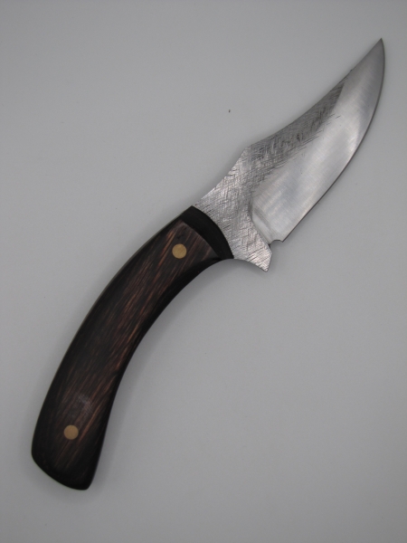 1095 high carbon steel clip point hunter skinner with a walnut dymalux handle 