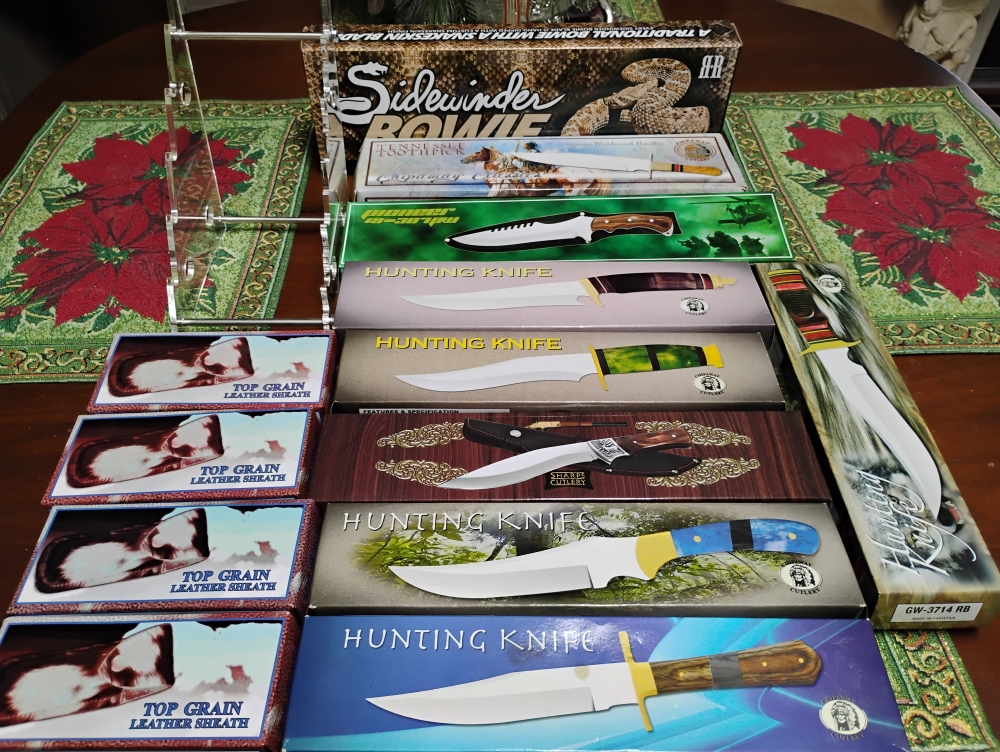 9 Fixed blades,4 cowhide sheaths, 1 acrylic stand 