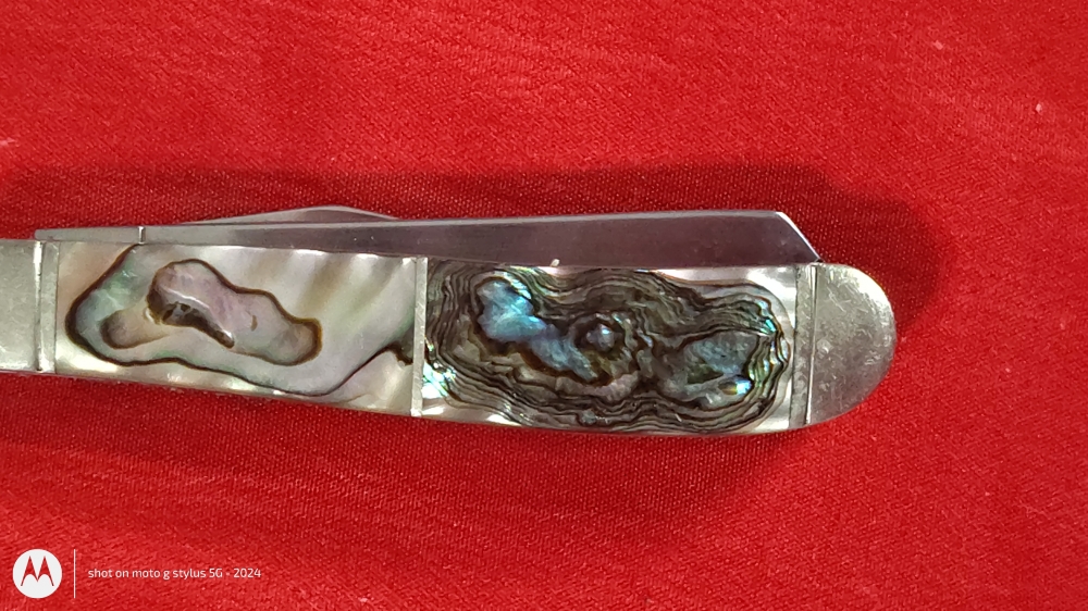 Remington Collector’s Series Dual-Blade Pocket Knife – Iridescent Handle – $75