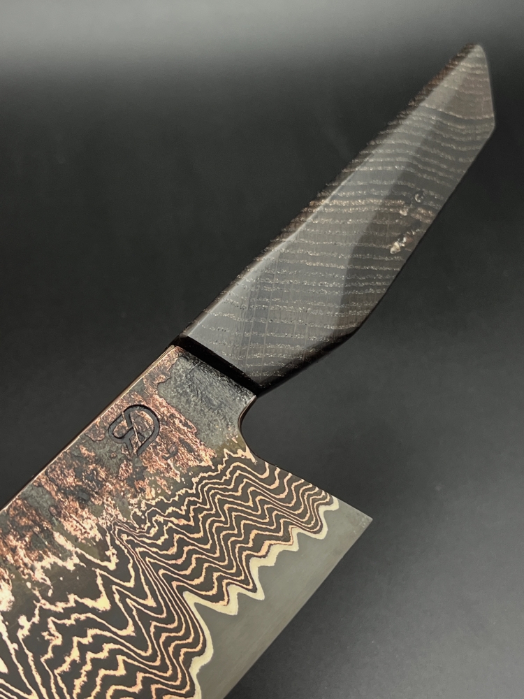 Apex ultra core with copperdamascus cladding