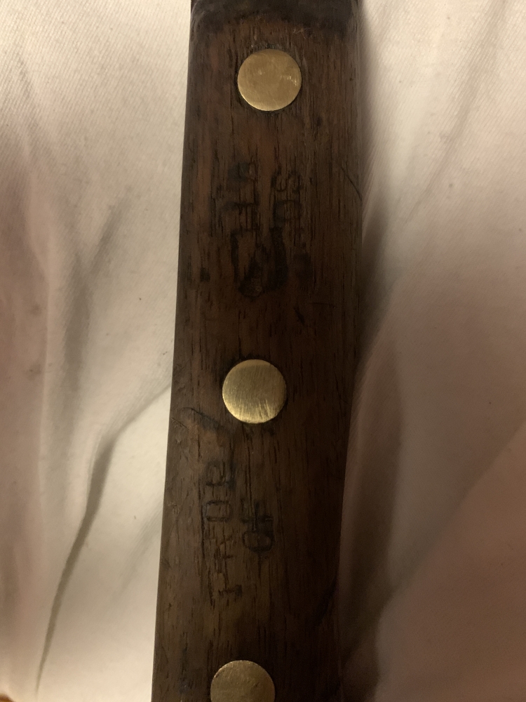 Vintage Cleaver made by Nichols Bros of Greenfield, MA. While it has no markings on the blade, the handle is stamped on both sides with “Prop Of Nichols Bros”