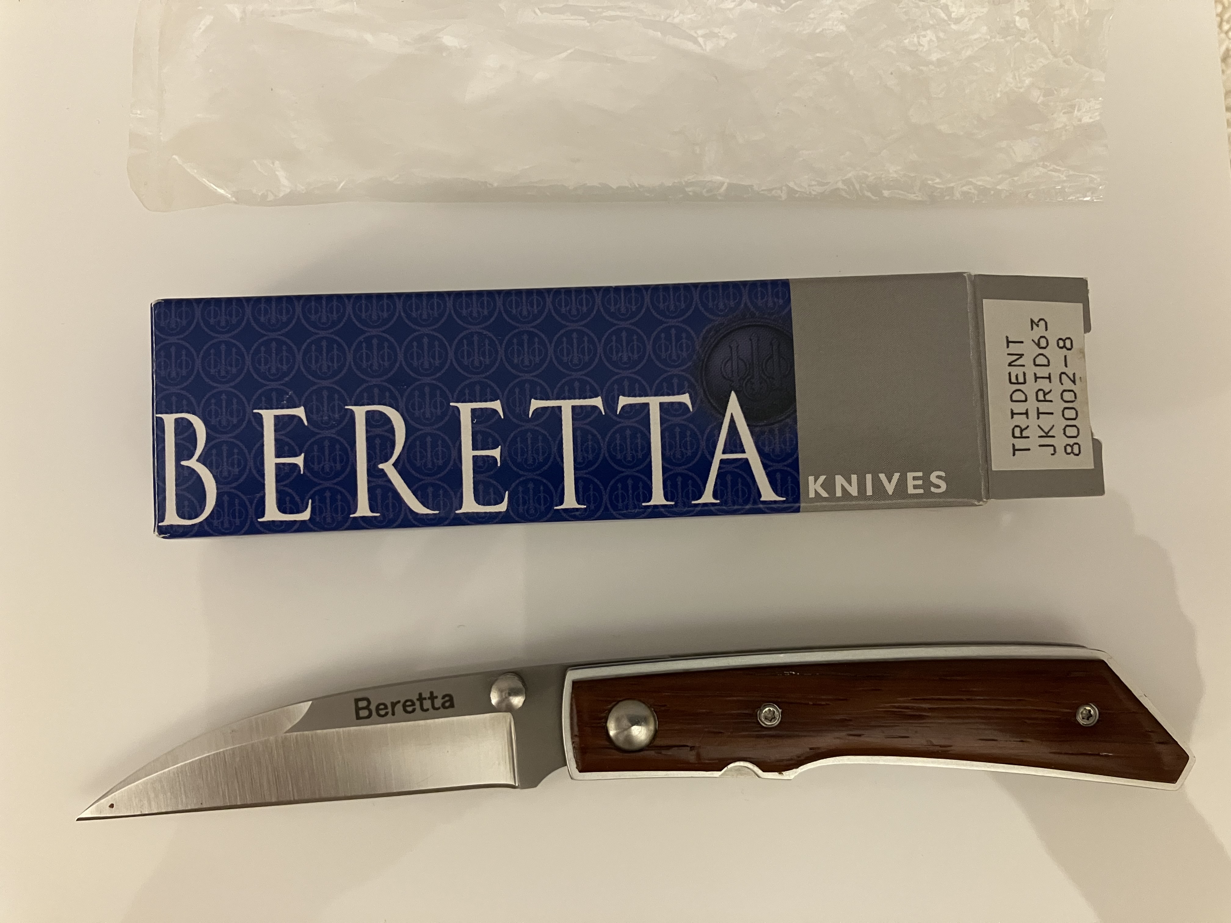 Unused discontinued Beretta Trident folding knife with African