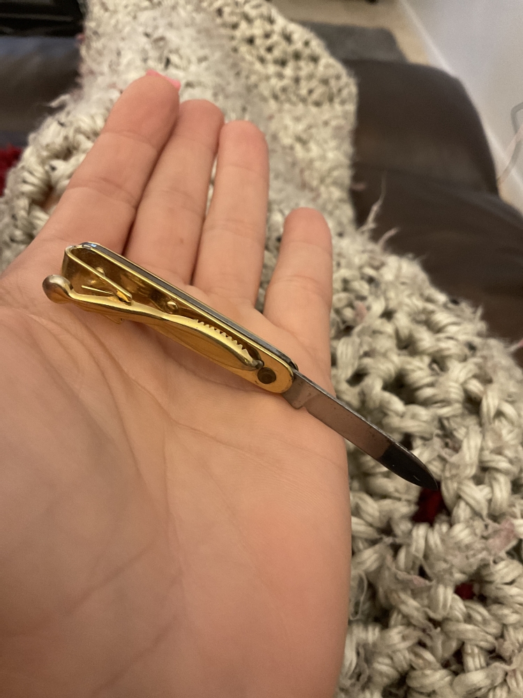 Two vintage souvenir folding knives a key and a tie clip very small