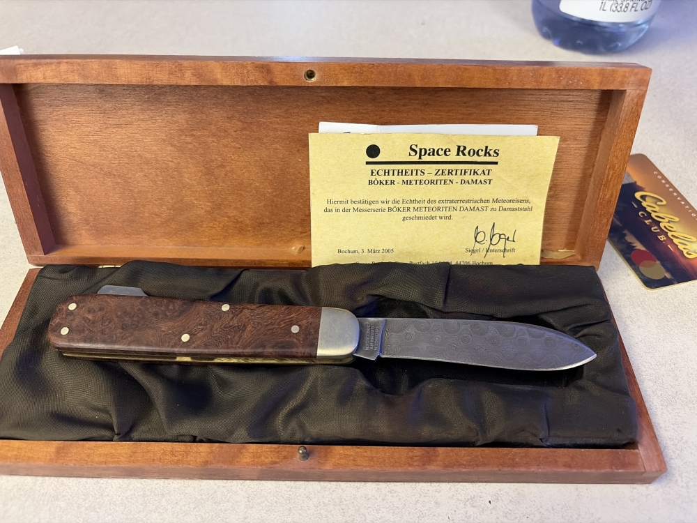 Space rocks, knife, made by Boker in Germany. Entire blade was made by metal from an asteroid. The metals content came out as perfect for aSpace rocks knife, made by Boker in Germany. Entire blade was made by metal from a asteroid. 
