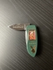 Two Franklin Mint 1970’s Playboy folding knives with nude photo 