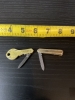 Two vintage souvenir folding knives a key and a tie clip very small