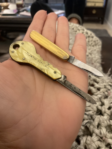 Two vintage souvenir folding knives a key and a tie clip very small