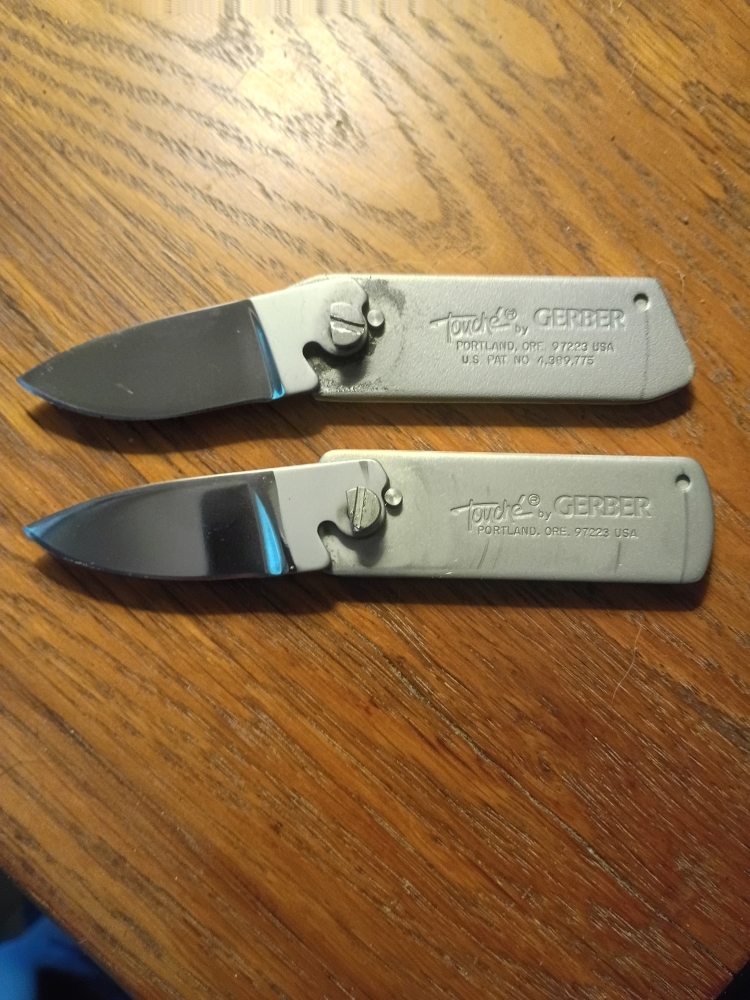 Pair Vintage Gerber Touche Belt Buckle Knives 
