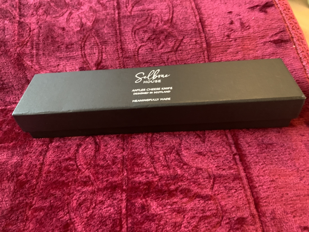 New in box Selbrae  house antler cheese knife designed in Scotland.22cm overall length.5cm wide with a beautiful antler handle. It weighs 130g with a 11cm handle
