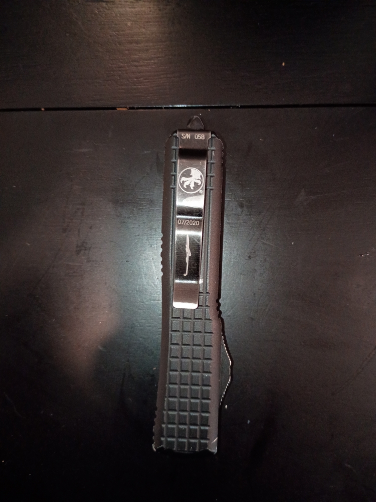 AI Mode All Exact matches Visual matches About this image Search tools AI Overview    +1 This appears to be a Microtech Ultratech Signature Series \"Frag\" pattern automatic knife, manufactured in July 2020. It features a black frag-pattern handle and is sp