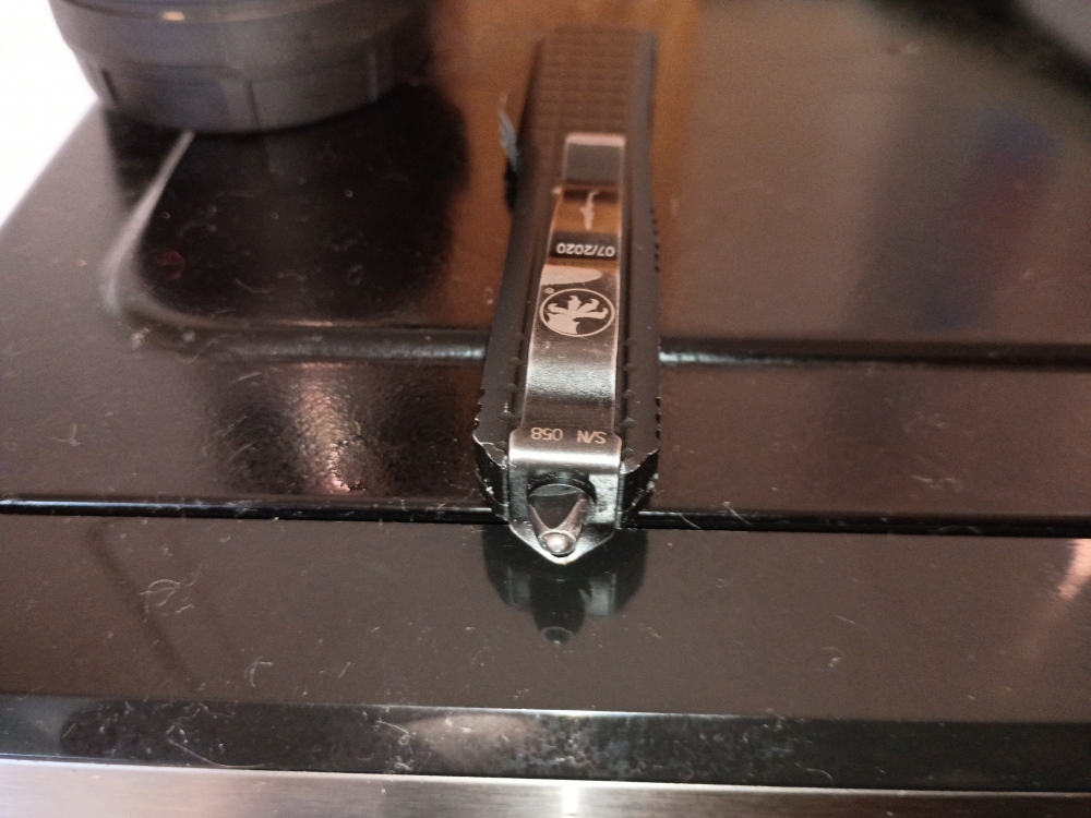AI Mode All Exact matches Visual matches About this image Search tools AI Overview    +1 This appears to be a Microtech Ultratech Signature Series \"Frag\" pattern automatic knife, manufactured in July 2020. It features a black frag-pattern handle and is sp