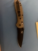 Bench Made Griptilian Serrated black drop point knife