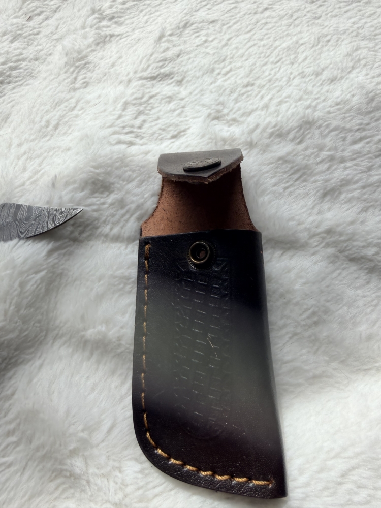 Handmade folding knife with belt pouch