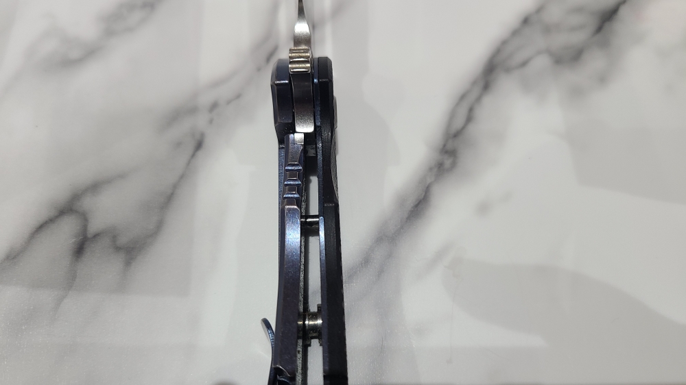 Hinderer XM-24 Bowie. Stonewashed blade with Blue titanium and Black G10 Scales.