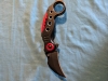 Black karambit style folding knife 