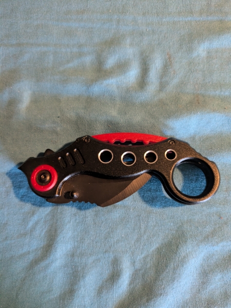 Black karambit style folding knife 
