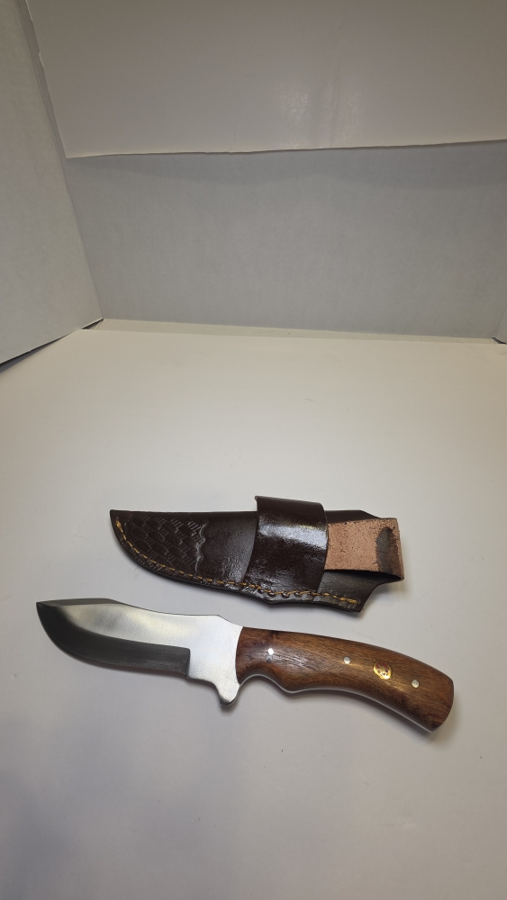 A fixed blade would handle D2 steel or 440C. Steel