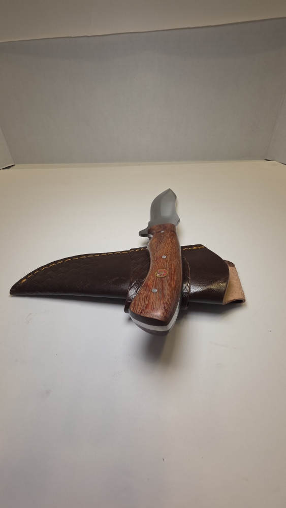A fixed blade would handle D2 steel or 440C. Steel