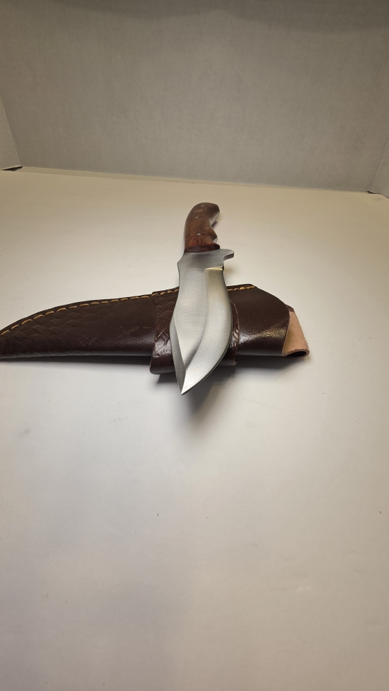 A fixed blade would handle D2 steel or 440C. Steel