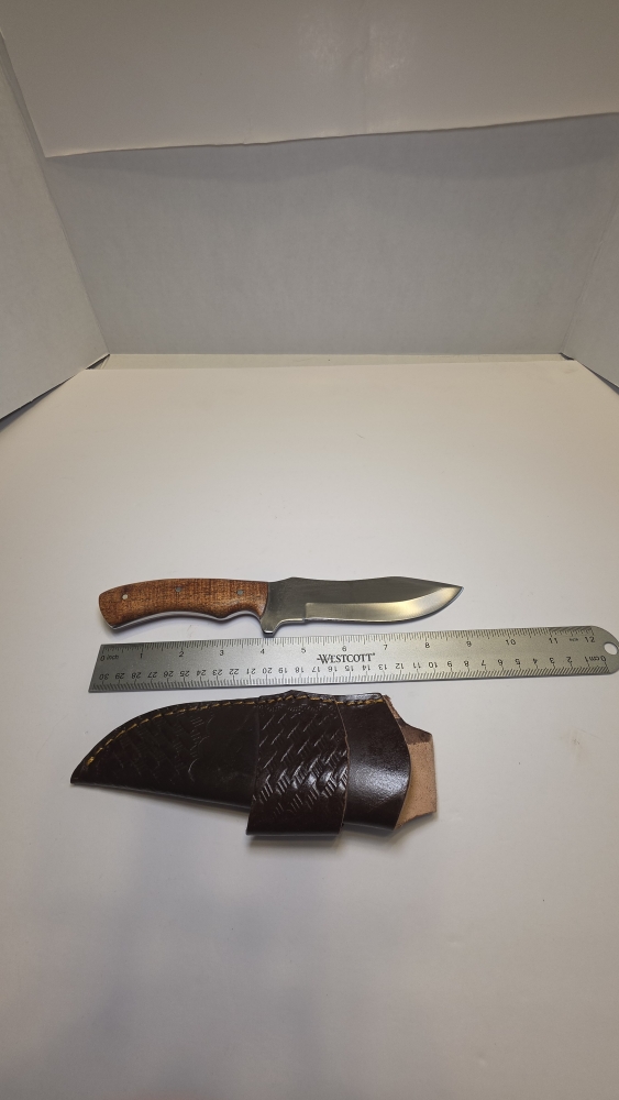 A fixed blade would handle D2 steel or 440C. Steel