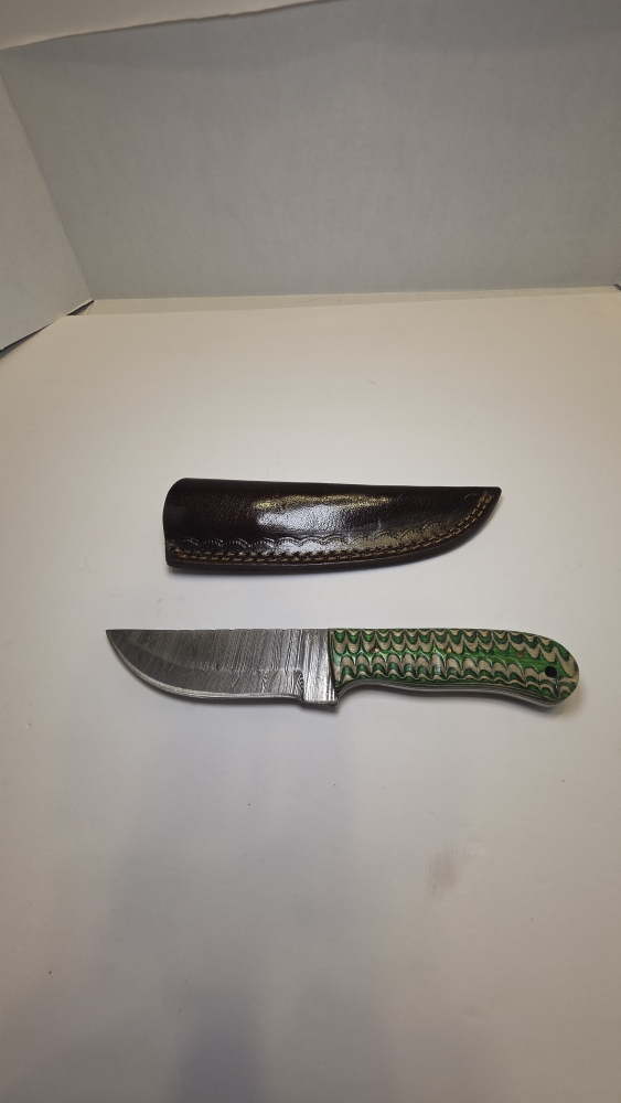 Damascus blade with a wood handle