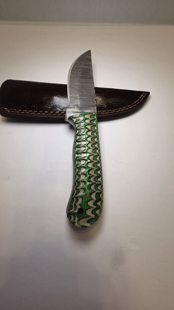 Damascus blade with a wood handle