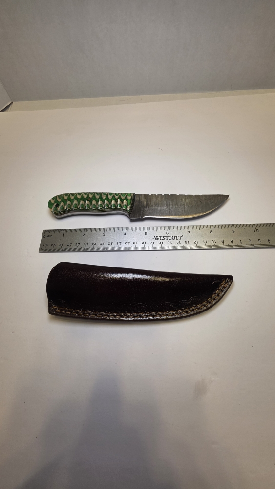 Damascus blade with a wood handle