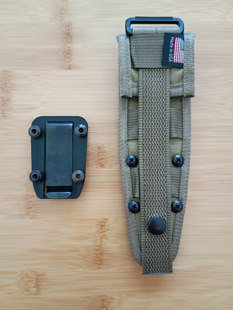ESEE Izula black oxide finish with included G10 handle scales and MOLLE back